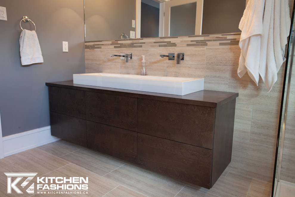Inspiration for a mid-sized modern 3/4 bathroom in Other with flat-panel cabinets, dark wood cabinets, an alcove shower, beige tile, ceramic tile, grey walls, ceramic floors, a vessel sink and laminate benchtops.