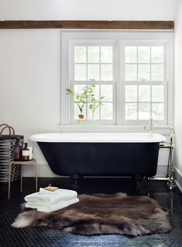 Design ideas for a traditional master bathroom in New York with a claw-foot tub and white walls.