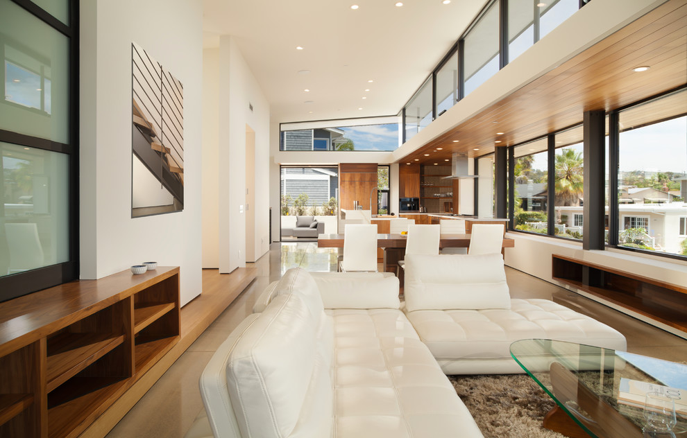 Photo of a large modern formal open concept living room in Orange County with white walls, linoleum floors, no fireplace, no tv and grey floor.