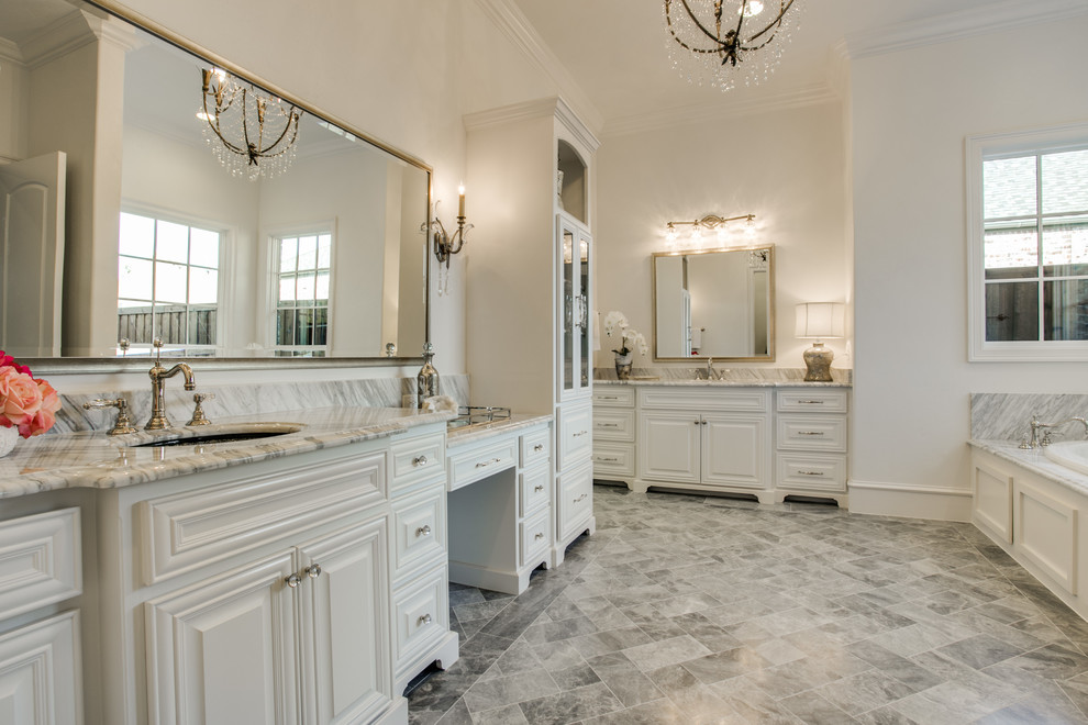 Large transitional master bathroom in Dallas with raised-panel cabinets, white cabinets, gray tile, stone tile and marble benchtops.