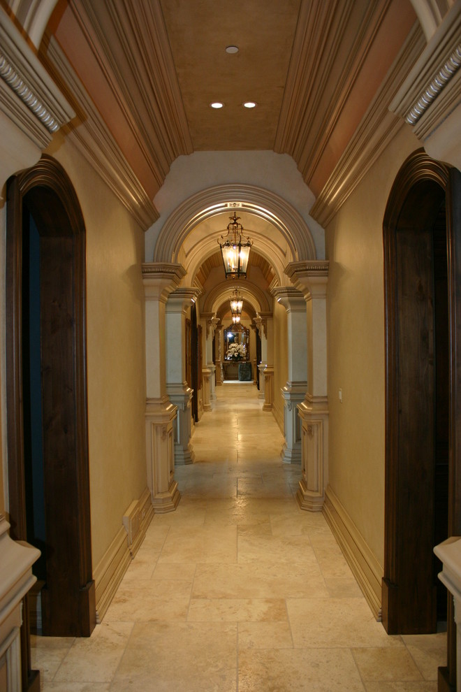 Design ideas for a mid-sized traditional hallway in Chicago with beige walls and limestone floors.
