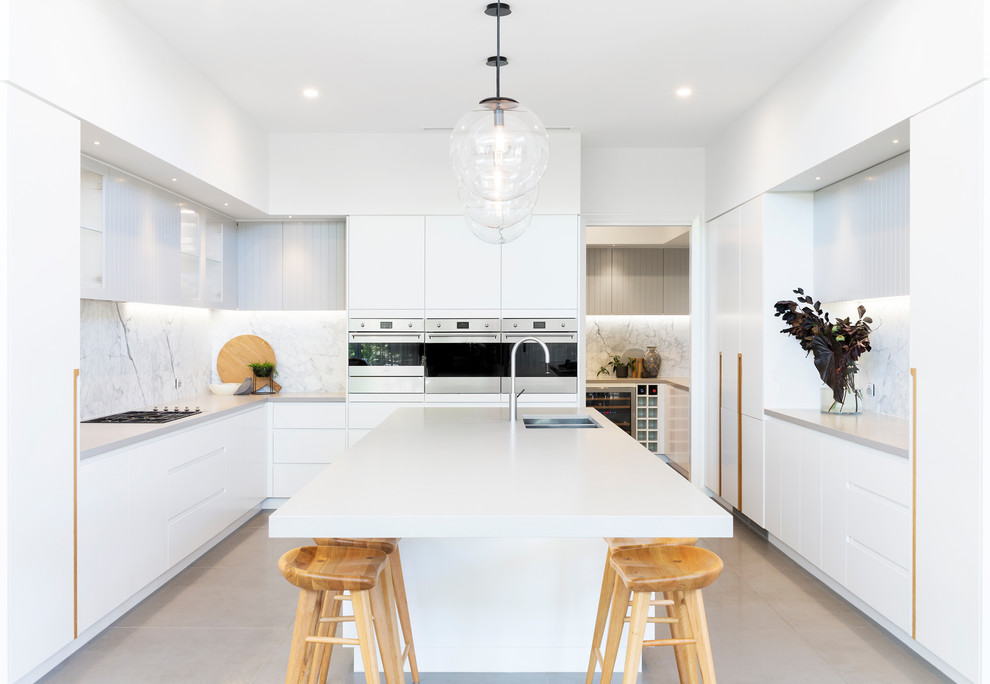 Design ideas for a contemporary u-shaped kitchen pantry in Canberra - Queanbeyan with an undermount sink, flat-panel cabinets, white cabinets, quartz benchtops, grey splashback, marble splashback, stainless steel appliances, porcelain floors, with island, multi-coloured floor and white benchtop.