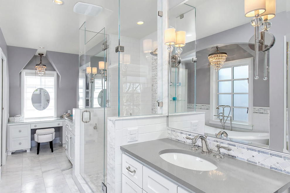 Mid-sized traditional master bathroom in Phoenix with an undermount sink, shaker cabinets, white cabinets, white tile, gray tile, grey walls, a freestanding tub, an alcove shower, subway tile, marble floors, engineered quartz benchtops, grey floor and grey benchtops.