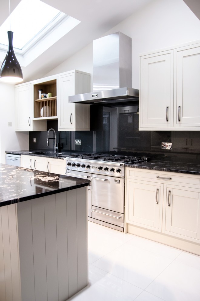 Design ideas for a modern kitchen in Hertfordshire with black splashback and glass sheet splashback.