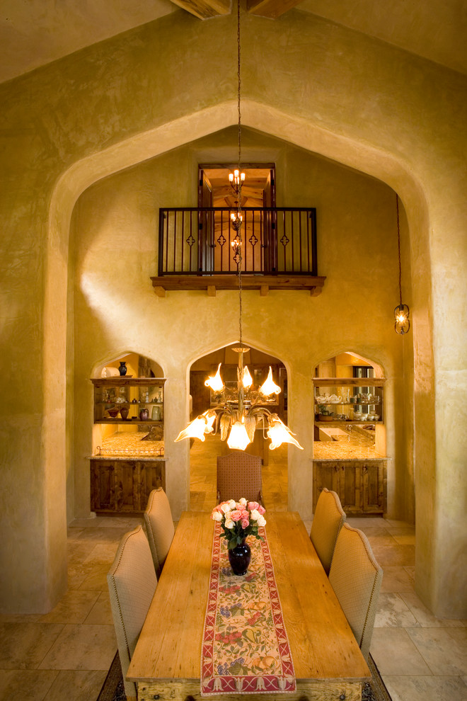 Photo of a mediterranean separate dining room in Albuquerque with beige walls and no fireplace.
