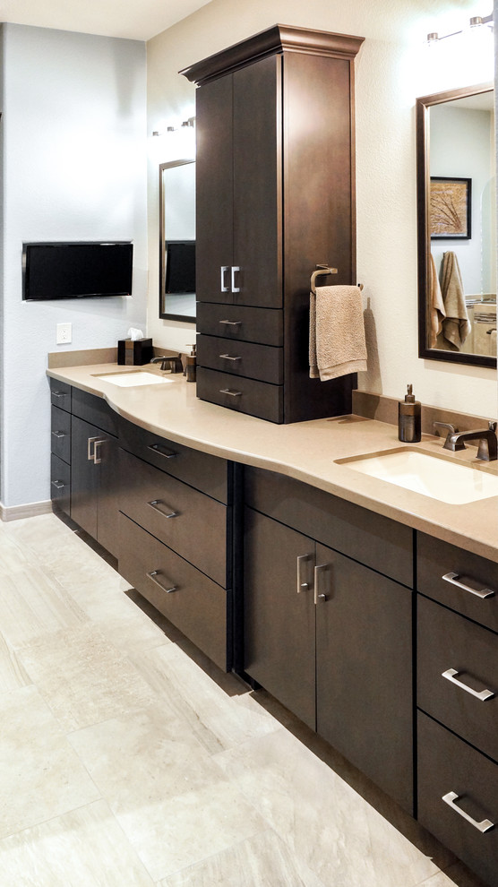 Mid-sized transitional master beige tile beige floor doorless shower photo in Phoenix with a two-piece toilet, beige walls, an undermount sink, quartzite countertops, flat-panel cabinets and brown cabinets