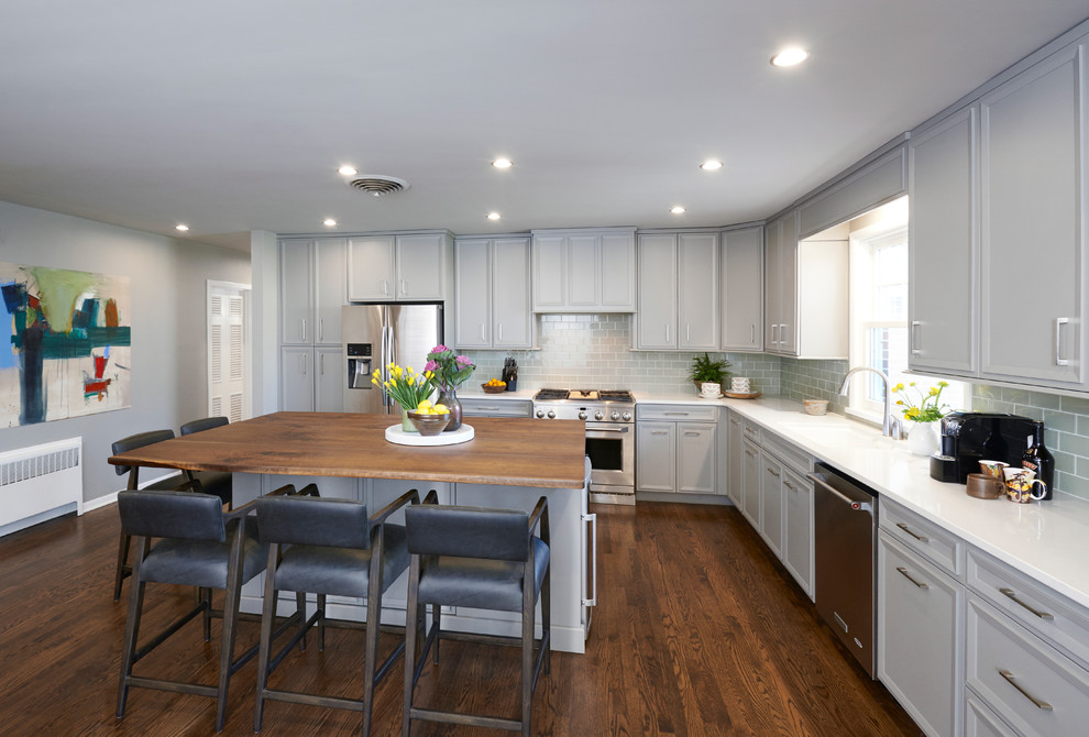 Eat-in kitchen - l-shaped eat-in kitchen idea with flat-panel cabinets, gray cabinets and an island