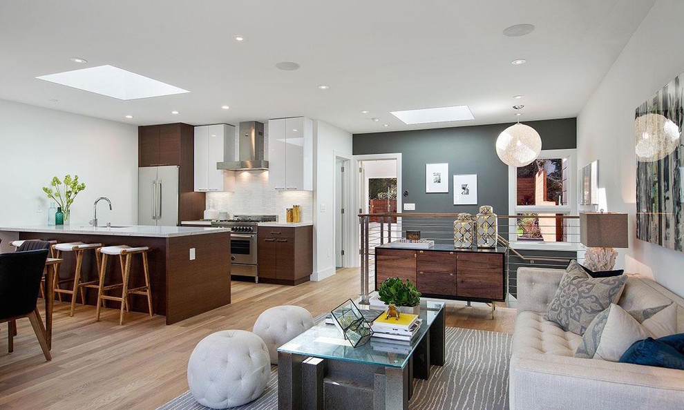 Inspiration for a contemporary open concept light wood floor living room remodel in Los Angeles with gray walls, no fireplace and no tv