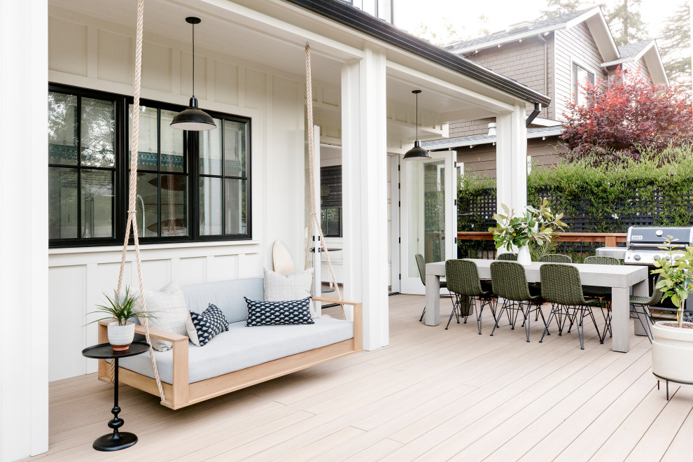 Beach style ground level deck in San Francisco with no cover and mixed railing.