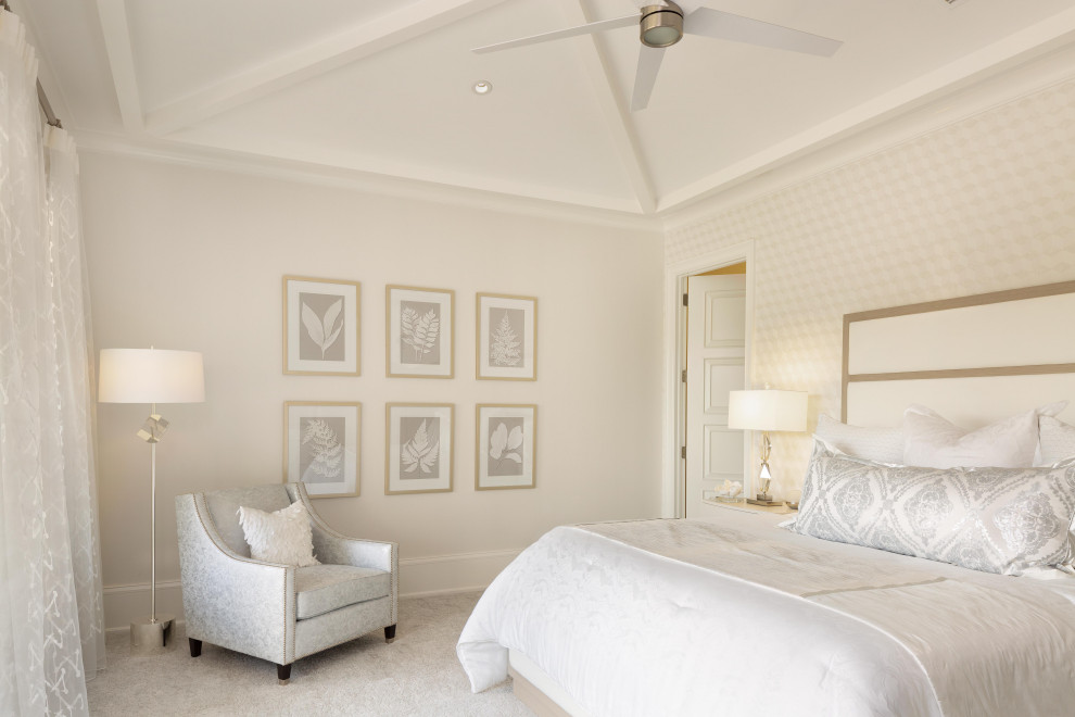 Photo of a mediterranean master bedroom in Miami with beige walls, carpet, no fireplace, grey floor and wallpaper.