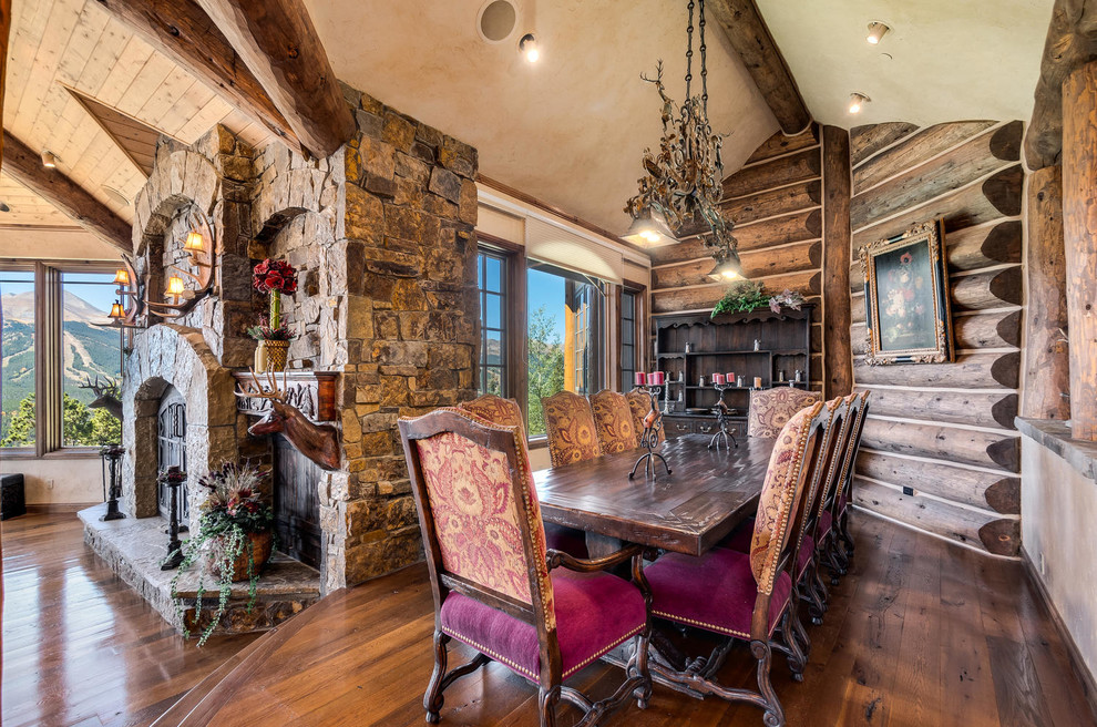 Example of a mountain style dining room design in Denver