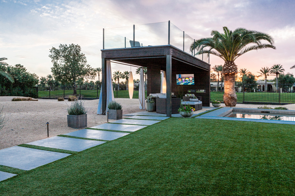 Inspiration for a modern backyard patio in Phoenix with concrete slab and a gazebo/cabana.