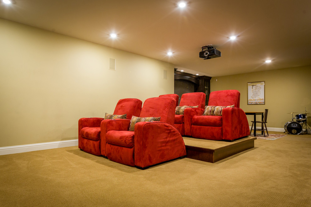 Photo of a mid-sized modern open concept home theatre in Calgary with brown walls, carpet and a projector screen.