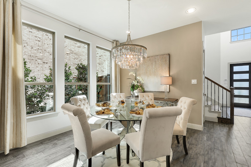 Photo of a large traditional open plan dining in Dallas with dark hardwood floors and beige walls.