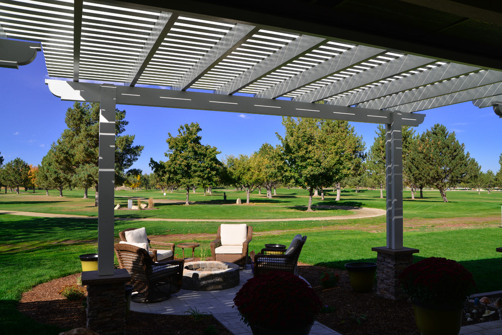 Inspiration for a mid-sized contemporary backyard patio in Boise with a pergola.