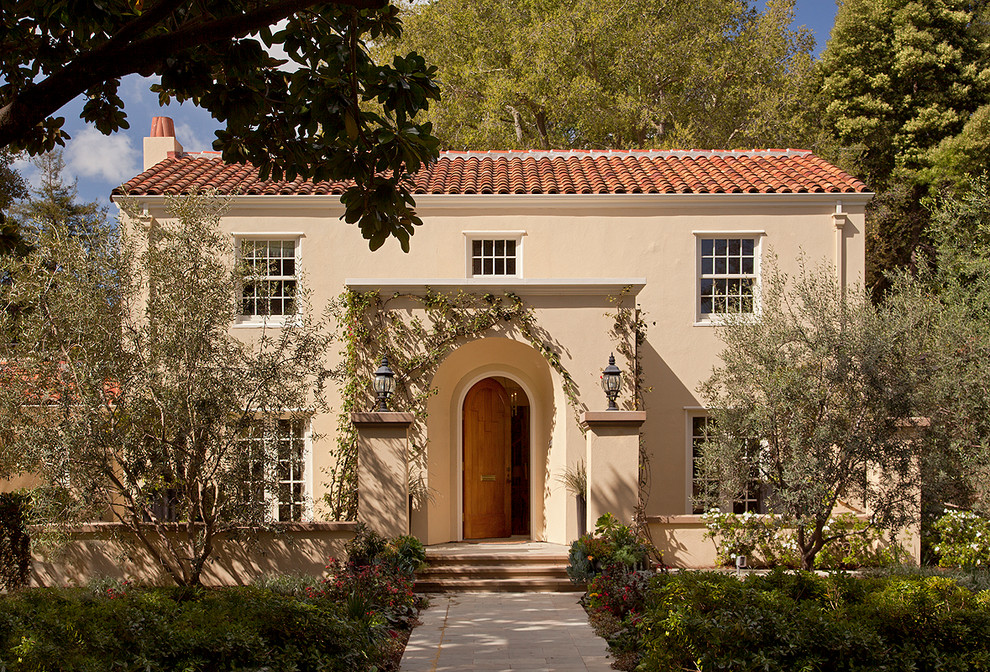 Inspiration for a mediterranean beige two-story exterior home remodel in San Francisco