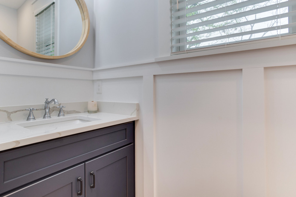 Small nautical cloakroom in Baltimore with recessed-panel cabinets, blue cabinets and a submerged sink.