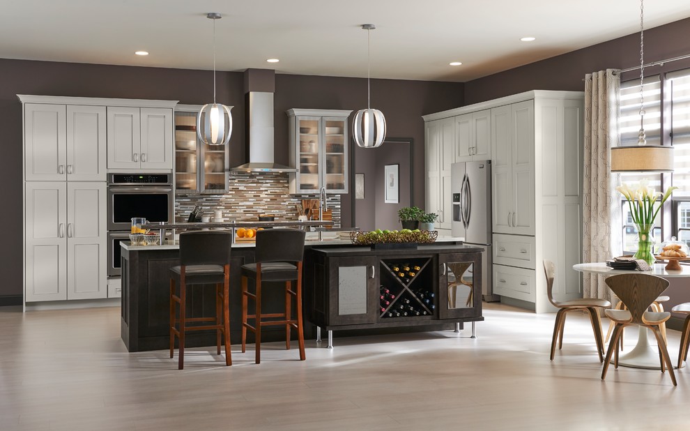 Inspiration for a large transitional l-shaped eat-in kitchen remodel with shaker cabinets, white cabinets and an island