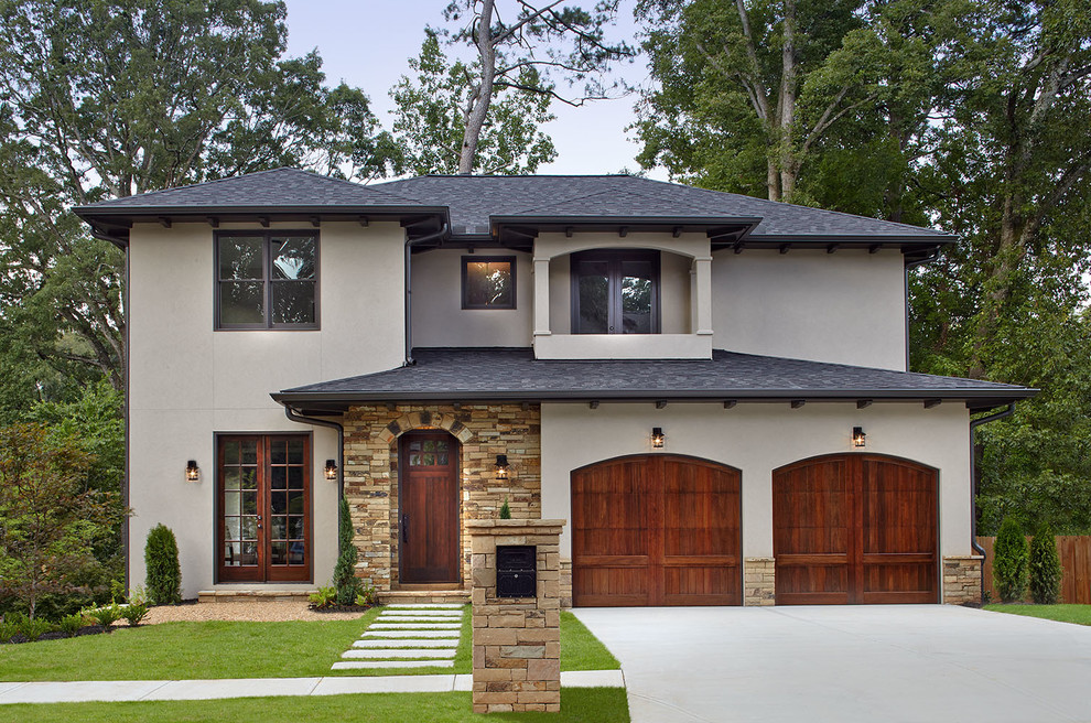 This is an example of a mid-sized mediterranean attached two-car garage in Atlanta.