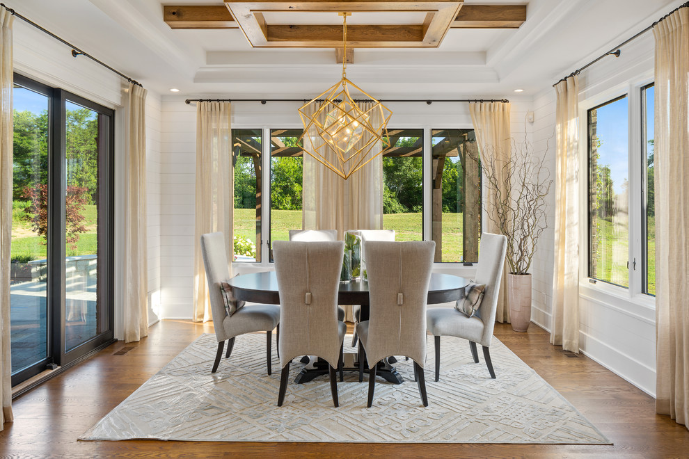 Inspiration for a country separate dining room in Cincinnati with white walls, medium hardwood floors and multi-coloured floor.
