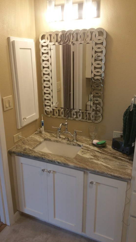 Example of a mid-sized transitional master gray tile and porcelain tile porcelain tile home design design in Austin with shaker cabinets, white cabinets, a two-piece toilet, beige walls, an undermount sink and granite countertops