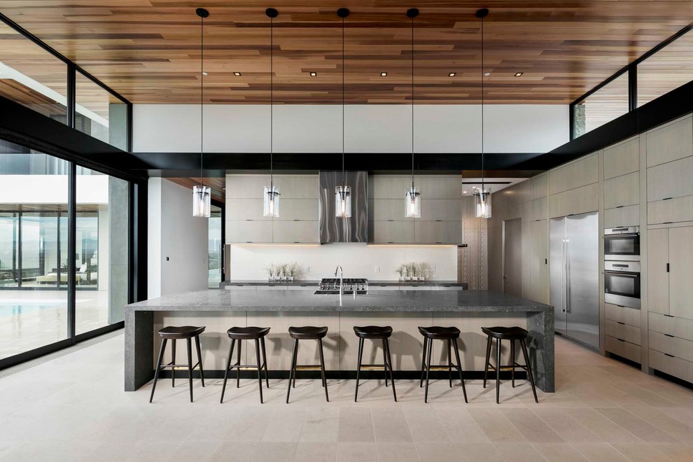 Enclosed kitchen - huge galley gray floor enclosed kitchen idea in Berlin with two islands
