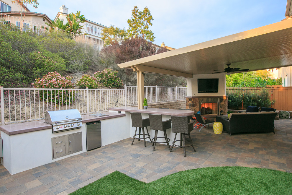 Photo of a mid-sized traditional backyard garden in San Diego with a fire feature.