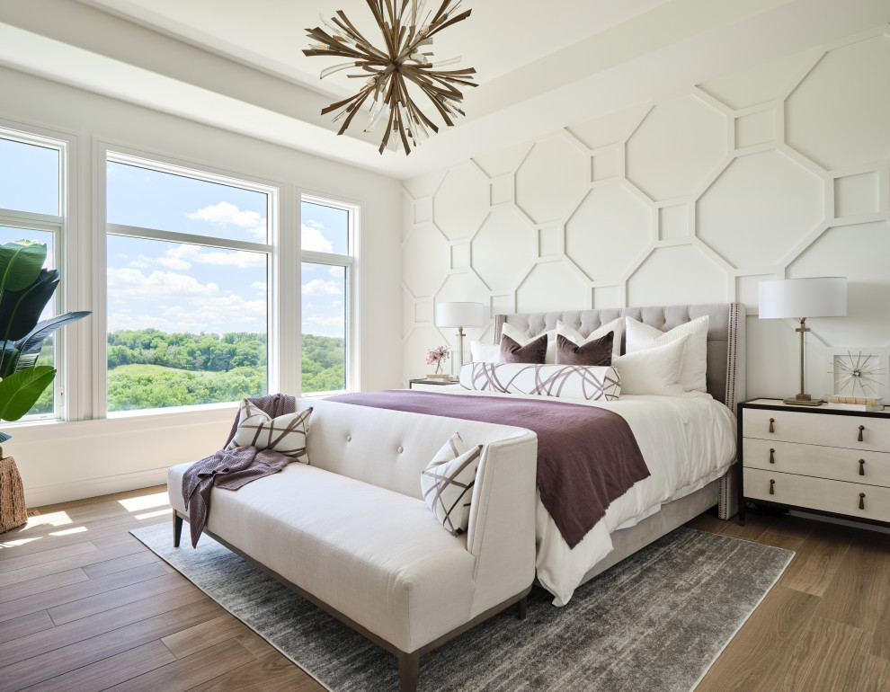 Inspiration for a large transitional master bedroom in Omaha with white walls, porcelain floors, beige floor, recessed and panelled walls.