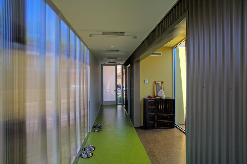 Design ideas for a modern hallway in Los Angeles with green floor.