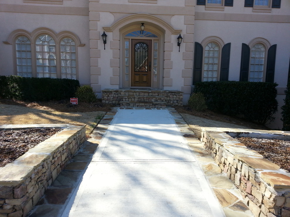 Stone patio, planters, and walkway