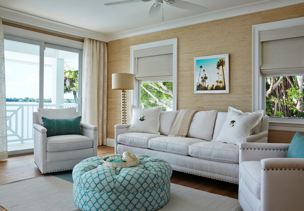 Inspiration for a mid-sized beach style enclosed living room in San Diego with brown walls, medium hardwood floors, no fireplace and brown floor.