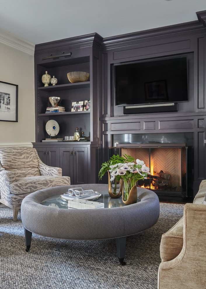 Inspiration for a transitional living room remodel in New York with beige walls, a standard fireplace and a wall-mounted tv