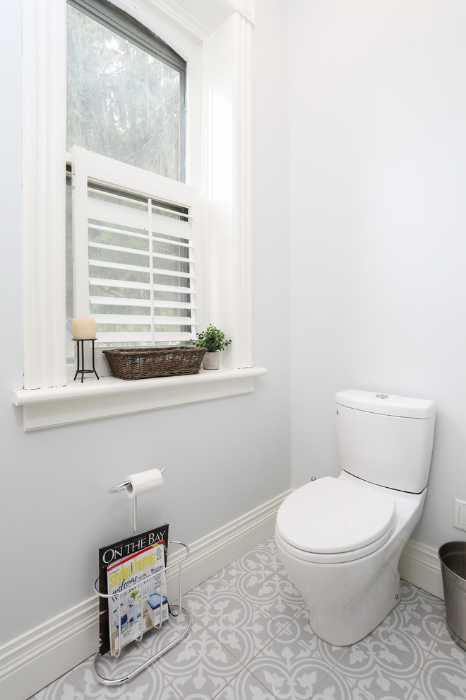 Shower curtain - mid-sized transitional 3/4 white tile gray floor shower curtain idea with a one-piece toilet, white walls and a pedestal sink