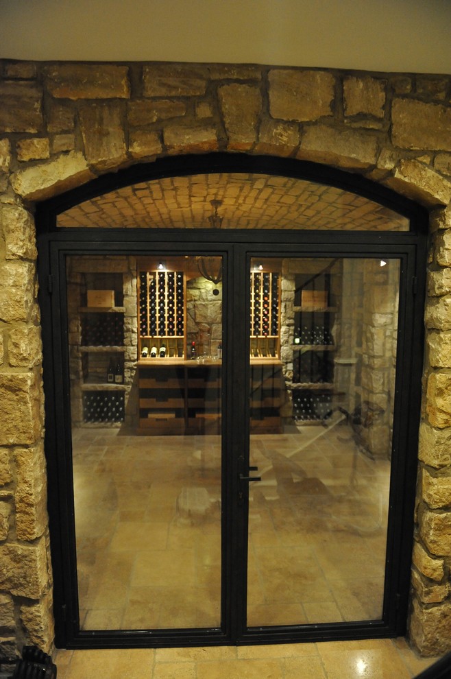 Inspiration for a mid-sized traditional wine cellar in San Francisco with ceramic floors and display racks.