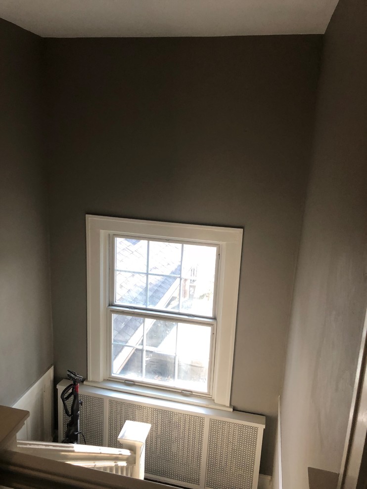 Window treatments for a tall stair landing