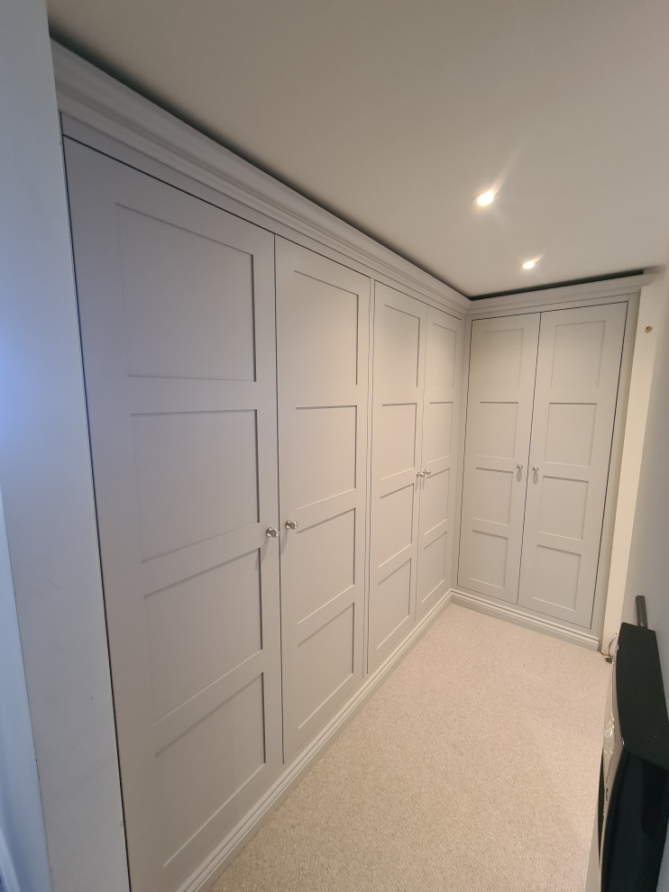 This is an example of a contemporary storage and wardrobe in Gloucestershire.