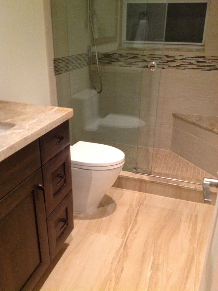 Transitional beige tile bathroom photo in Miami with recessed-panel cabinets, dark wood cabinets and quartzite countertops