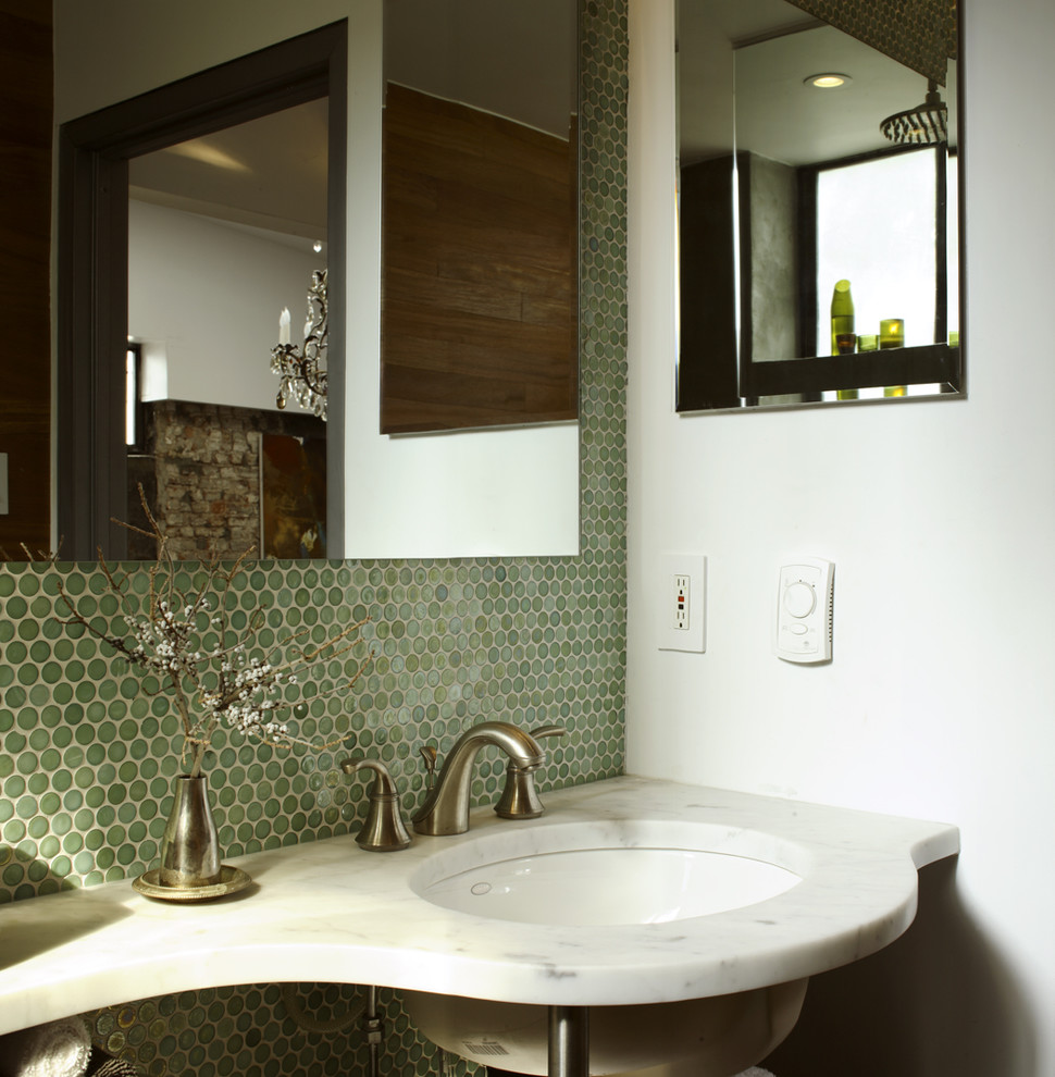 This is an example of a contemporary bathroom in New York with green tile, mosaic tile and marble benchtops.