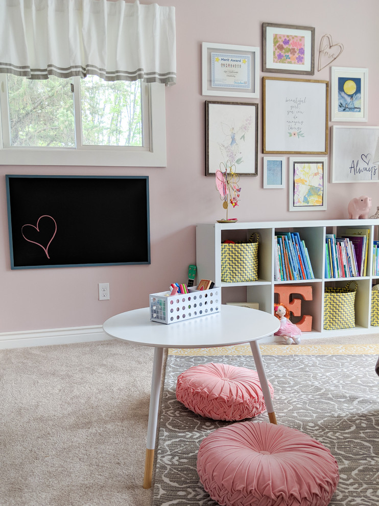 Inspiration for a mid-sized transitional kids' bedroom for kids 4-10 years old and girls in Other with pink walls, carpet and beige floor.