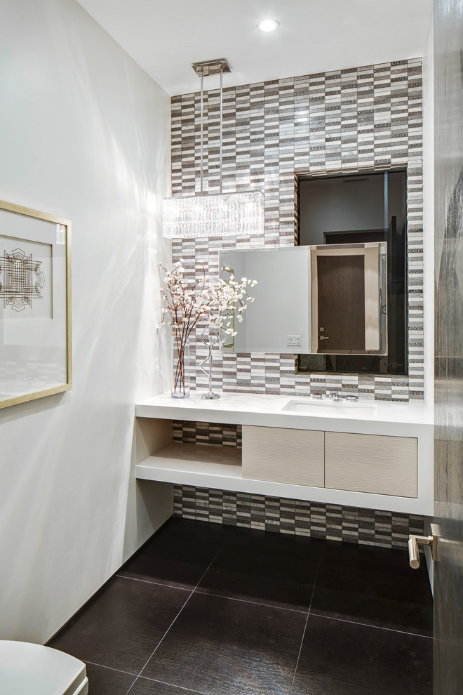 Mid-sized trendy gray tile, brown tile and porcelain tile powder room photo in Los Angeles with an undermount sink, open cabinets, light wood cabinets, white walls and white countertops