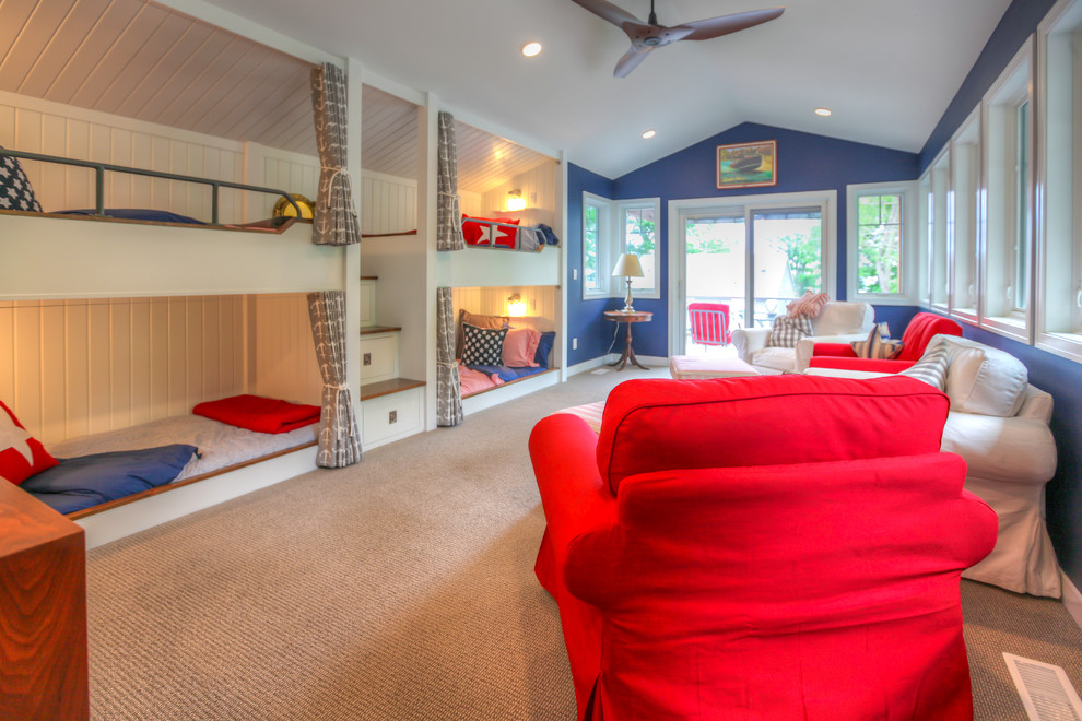 Kennedy Lake House - Cottage carpeted kids' room photo in Grand Rapids with blue walls