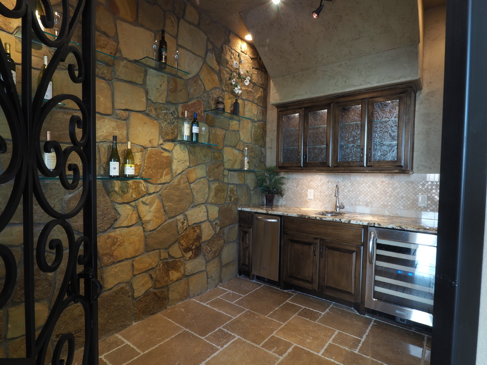 Inspiration for a mid-sized mediterranean wine cellar in Dallas with terra-cotta floors and display racks.