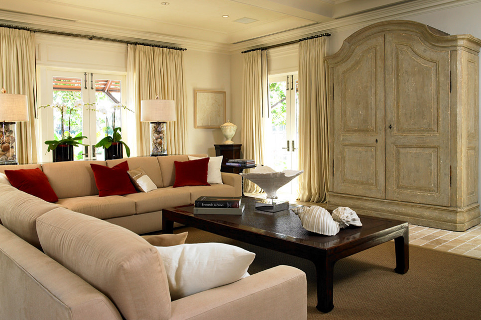 This is an example of a large eclectic living room in Miami with white walls and beige floor.