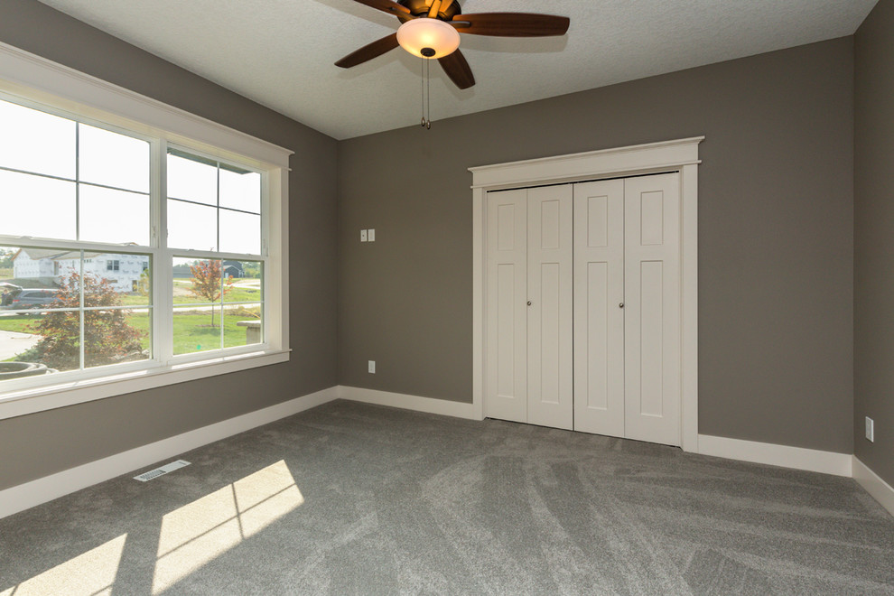 Transitional guest carpeted and gray floor bedroom photo with gray walls