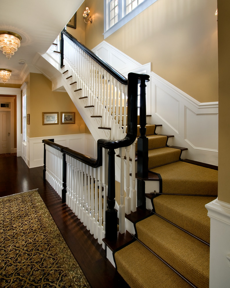 Staircase - large traditional carpeted straight wood railing staircase idea in Orlando with wooden risers