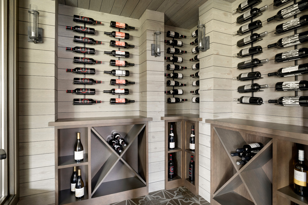 Transitional wine cellar in Minneapolis with diamond bins and multi-coloured floor.