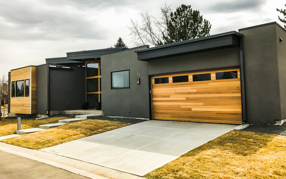 Inspiration for a mid-sized modern attached two-car garage in Denver.
