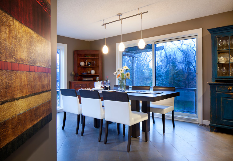 Medium sized contemporary kitchen/dining room in Toronto with brown walls and porcelain flooring.