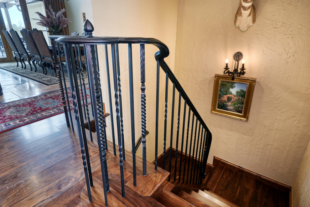 Custom railing and Walnut floors