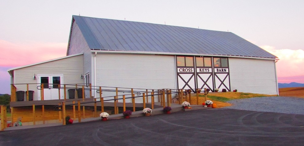 Large rustic gray two-story vinyl gable roof idea